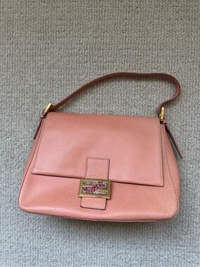 Salmon pink Fendi Mama Baguette bag with marble clasp detail. Great condition.